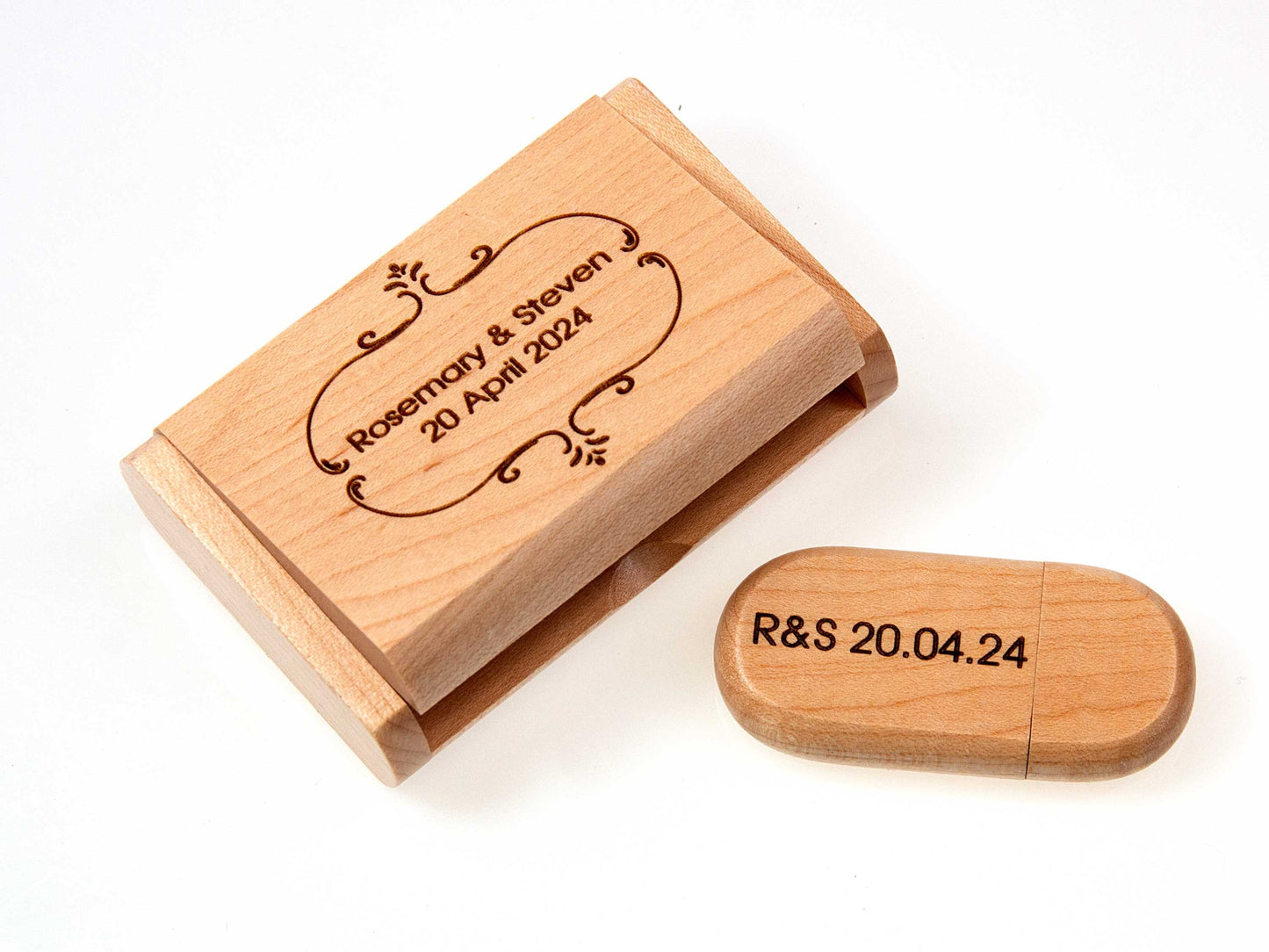 The Cathcart Elliot Personalised Maple wood USB 3.0 32GB flash drive set features a presentation box engraved with text and the USB marked with text, elegantly presented on a white background.