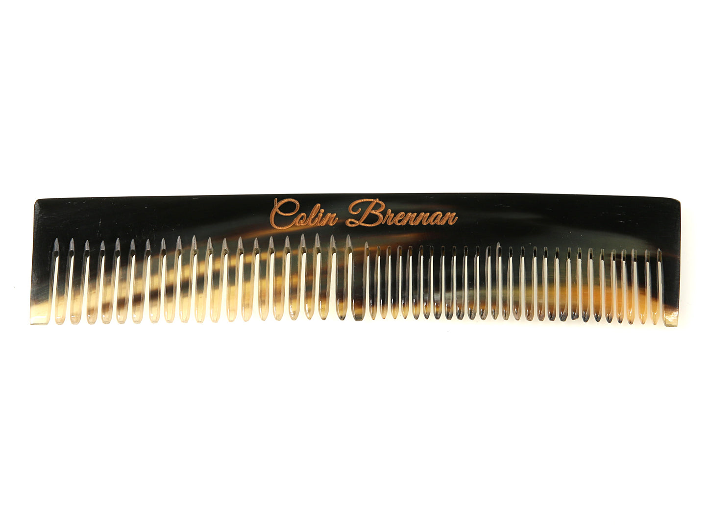 Horn comb with teeth and branding on a white background