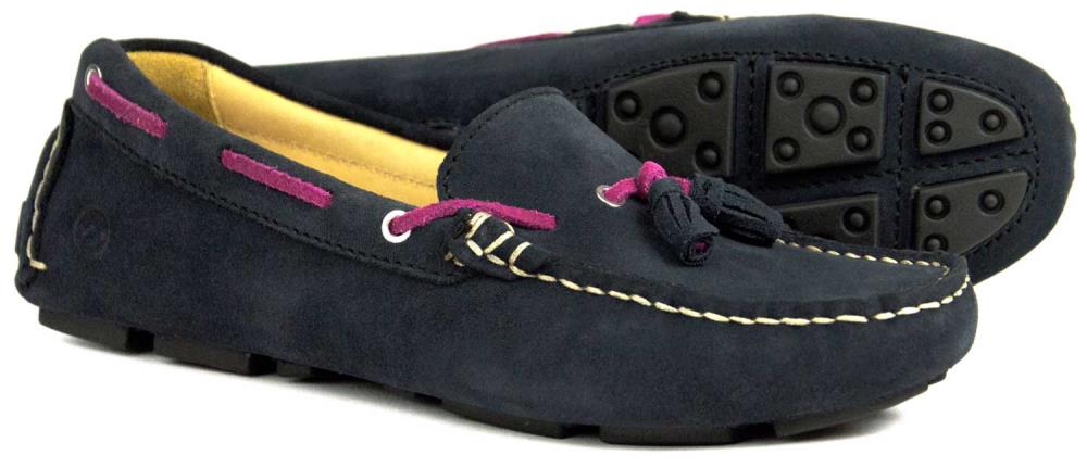 The SALE Orca Bay Sicily Navy Blue Suede Ladies Tassel Loafer features white stitching, pink lace accents, front tassels, and a black rubber grip sole—perfect as stylish and comfortable driving shoes.