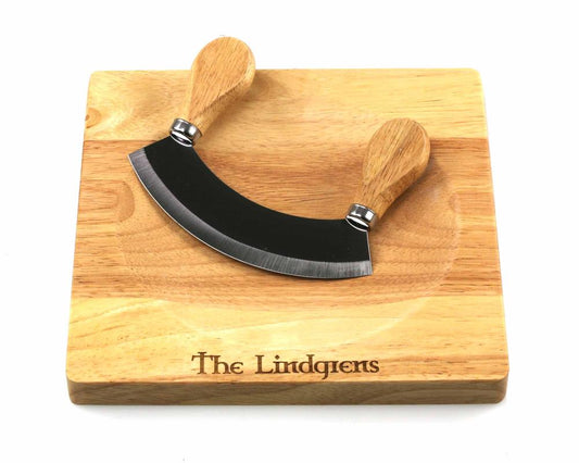 The *Second* Personalised mezzaluna wooden herb chopper board by Cathcart Elliot features an engraved rubber wood board and double-handled mezzaluna—ideal for chopping herbs or vegetables.