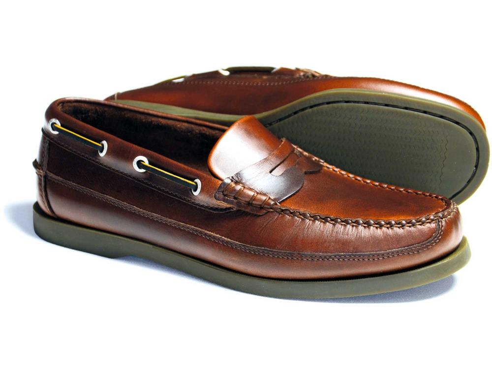 The FRIPP Men’s Slip-on Deck Shoe Loafer in Elk Brown by Orca Bay features visible stitching, non-slip rubber soles, and side lacing details, shown against a white background.