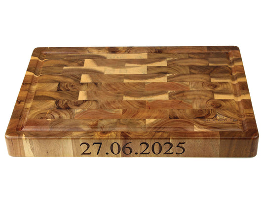 The Cathcart Elliot Large Acacia Wood Carving Chopping Cutting Board (40x30x4cm) features a unique grain, measures 40x30x4cm, and can be engraved with your chosen date—ideal as a personalised kitchen or special occasion board.