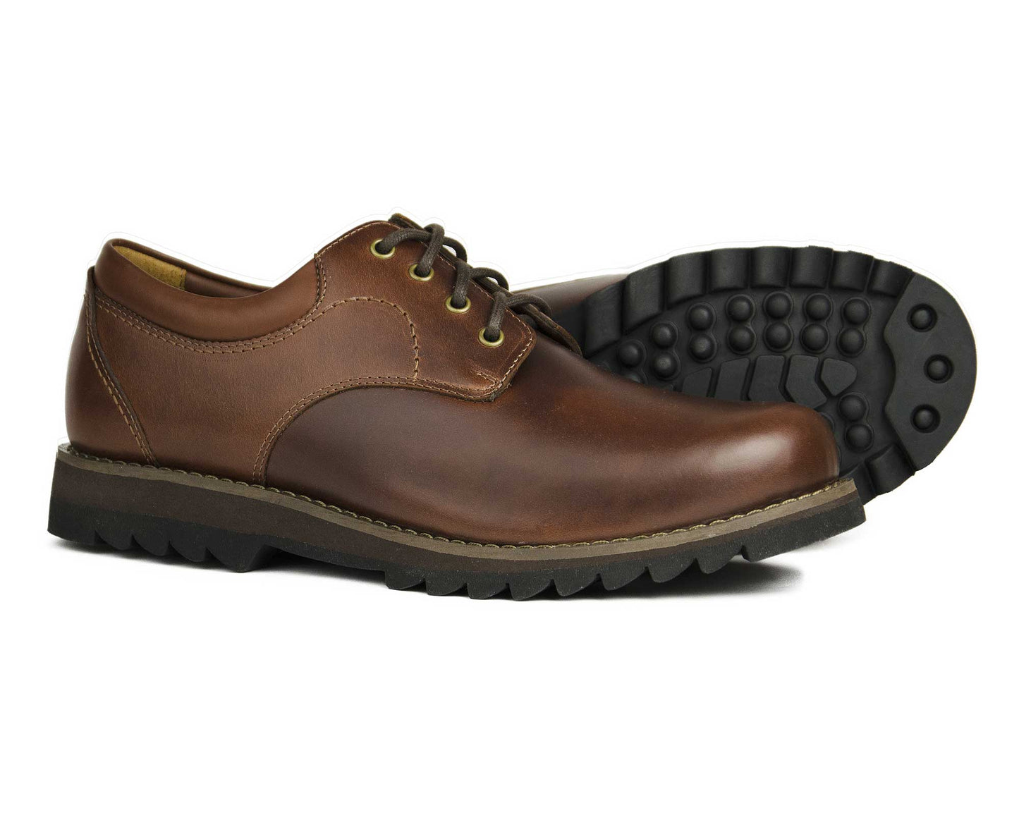 The BILBURY Men's Elk Brown Leather Country Derby Shoe from Orca Bay features rugged black rubber soles. One shoe stands upright, while the other is on its side to showcase its lightweight, grippy sole and unique tread pattern.