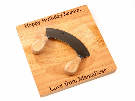 The Cathcart Elliot Personalised Mezzaluna Wooden Herb Chopper Board, engraved with Happy Birthday Jasmin. Love from MamaBear, comes with a double-handled chopper—thoughtful and practical for herb prep.