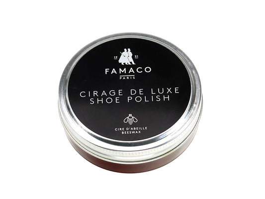 A round tin of Cathcart Elliot Premium Beeswax Shoe Polish (50ml) with a screw top, featuring a black lid, white text, and a small icon of people. The label highlights its beeswax content, making it ideal for nourishing and protecting high-quality shoe leathers.