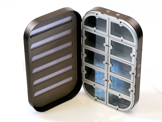 The Cathcart Elliot Personalised Grey Aluminium Fly Box for Dry & Wet Flies has a metallic rectangular design, foam-lined slots, ten clear compartments with hinged lids—an engraved fishing gift ideal for anglers.