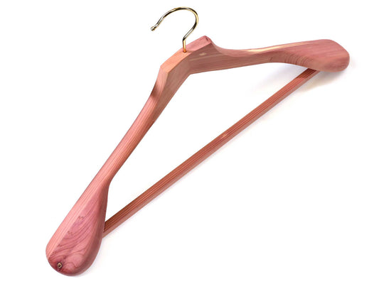 The Personalisable 48cm cedar wood suit and jacket hanger by Cathcart Elliot features a gold hook, broad contoured shoulders, a horizontal bar, and visible reddish-brown cedar grain.