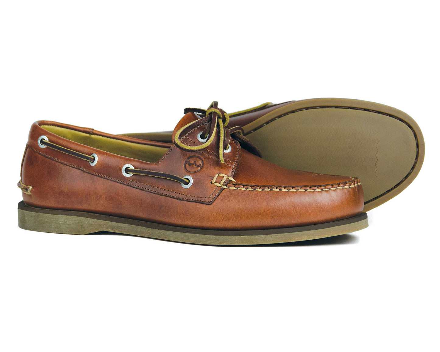 From the Orca Bay Ocean Gold collection, the Newport mens premium brown leather deck shoes showcase white stitching and lace detailing. One shoe stands while the other leans to highlight the textured sole and light beige interior.