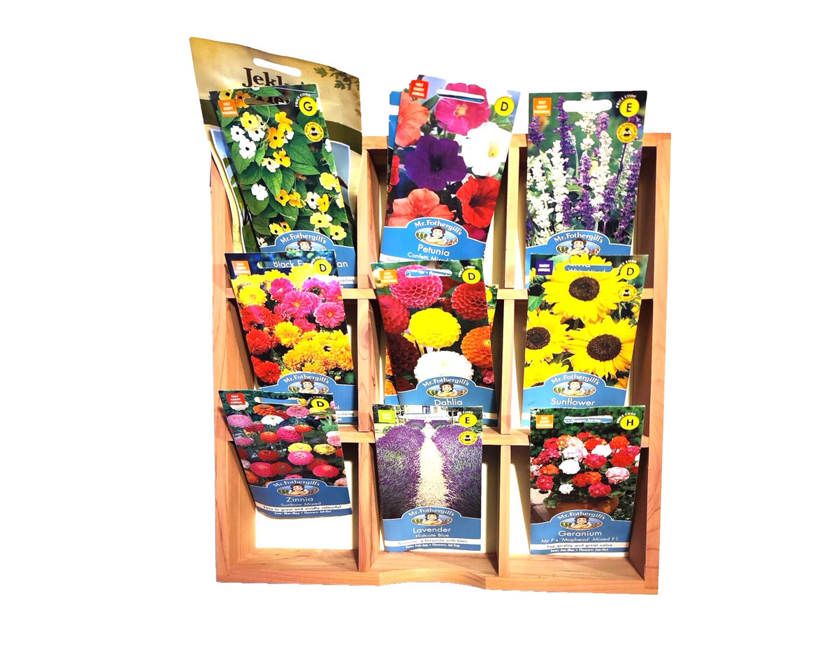 The Cathcart Elliot 31cm x 31cm Cedar Wood Organiser tray neatly showcases seed packets of sunflowers, pansies, and marigolds with vibrant images, allowing easy selection for your garden.