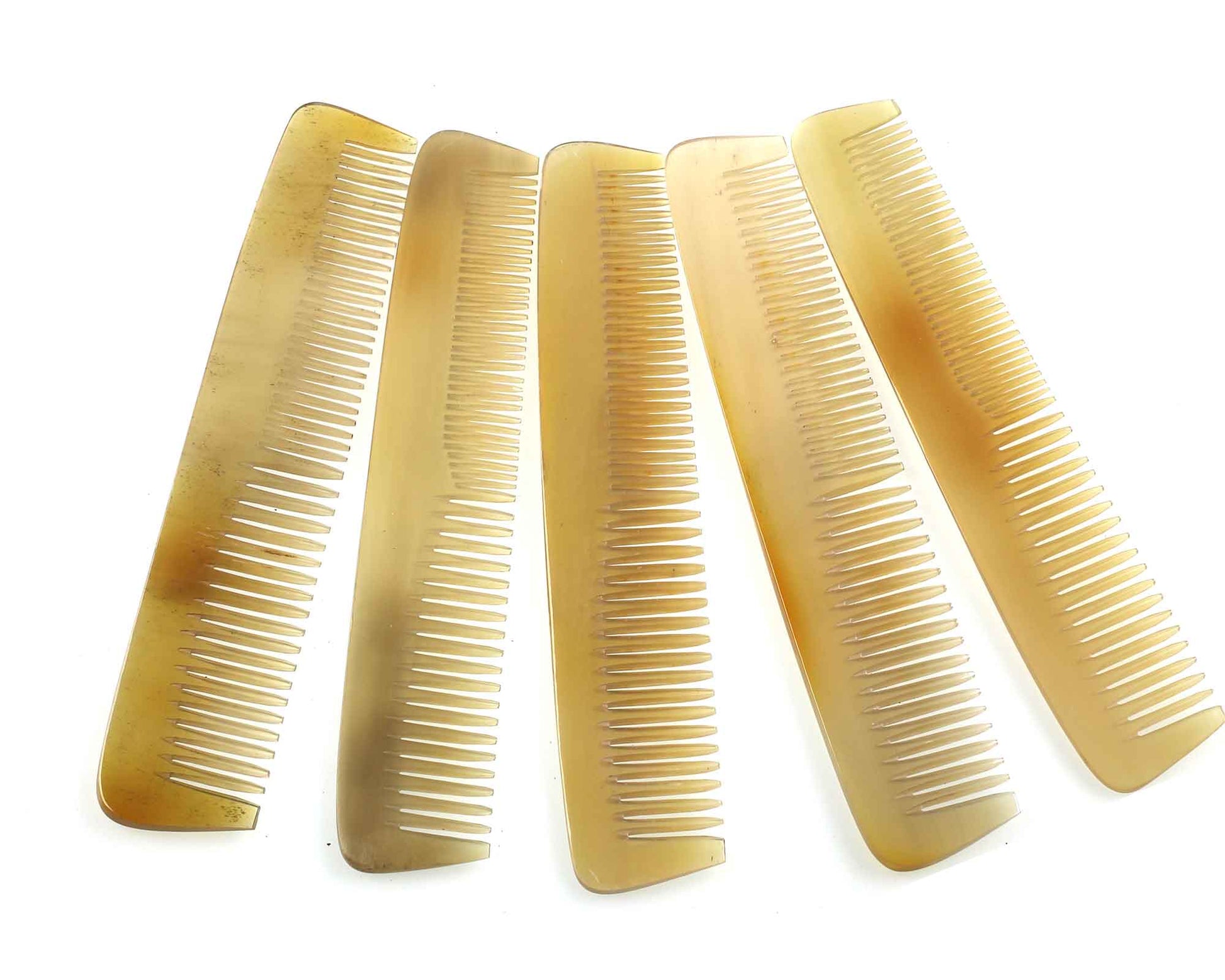 Five Cathcart Elliot Personalised Plain Pale/Translucent real horn combs, each 6 inches long, are arranged in a fan shape on a white background.