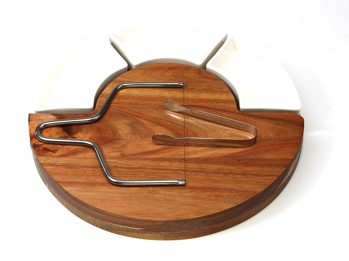 The Cathcart Elliot second Personalised 30cm Round Acacia Cheeseboard Server Sharing Platter features three white ceramic dishes, metal tongs, and a cheese slicer—perfect for stylish serving, all neatly arranged on the board against a white background.