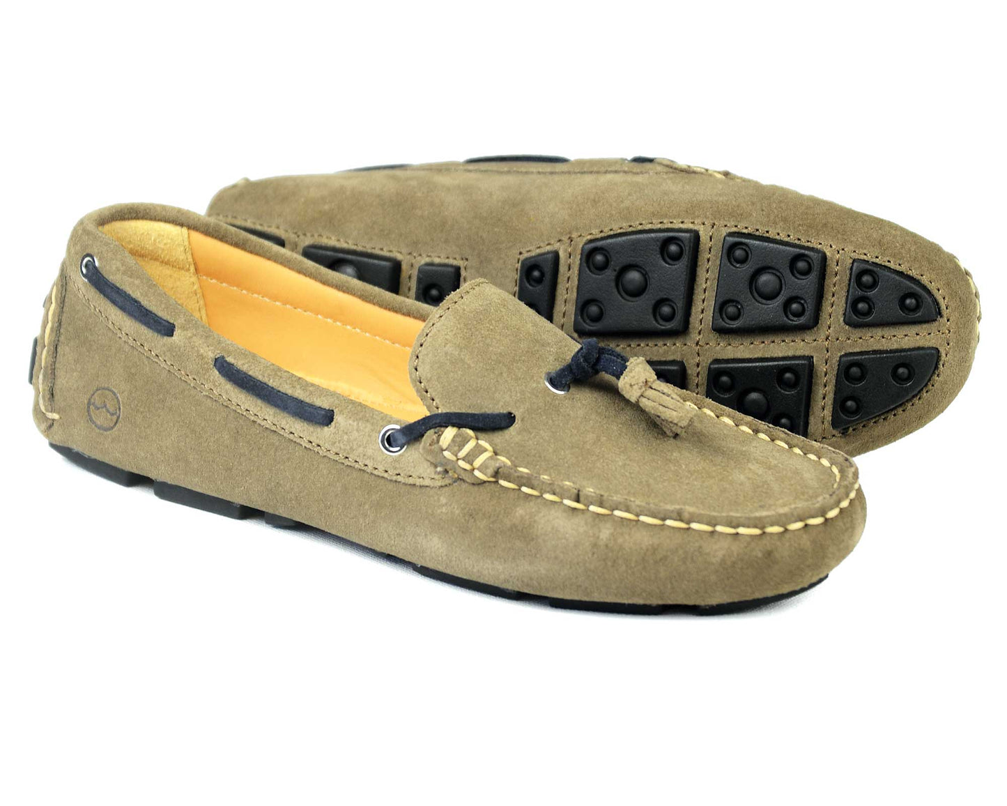 SALE SICILY Womens Mushroom Suede Loafer by Orca Bay features premium suede uppers, black leather laces, and a lightweight rubber sole with round grip pads. One shoe is upright while the other lies on its side to display the unique sole design.