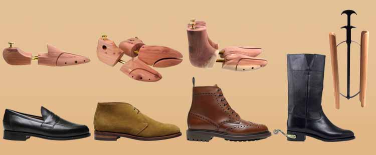 An image showing shoe and boot stretchers above various types of footwear, including a black loafer, brown suede shoe, brown leather boot, and a tall black boot, on a beige background.