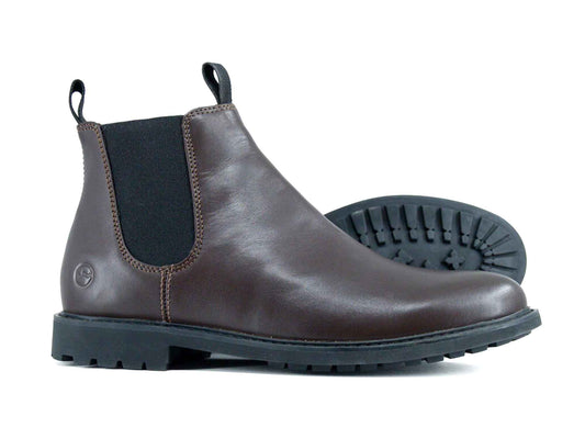 The HENLEY Mens Ankle Boot by Orca Bay is a dark brown leather Chelsea boot with black elastic side panels and black rubber soles, shown upright and on its side to highlight the durable tread.