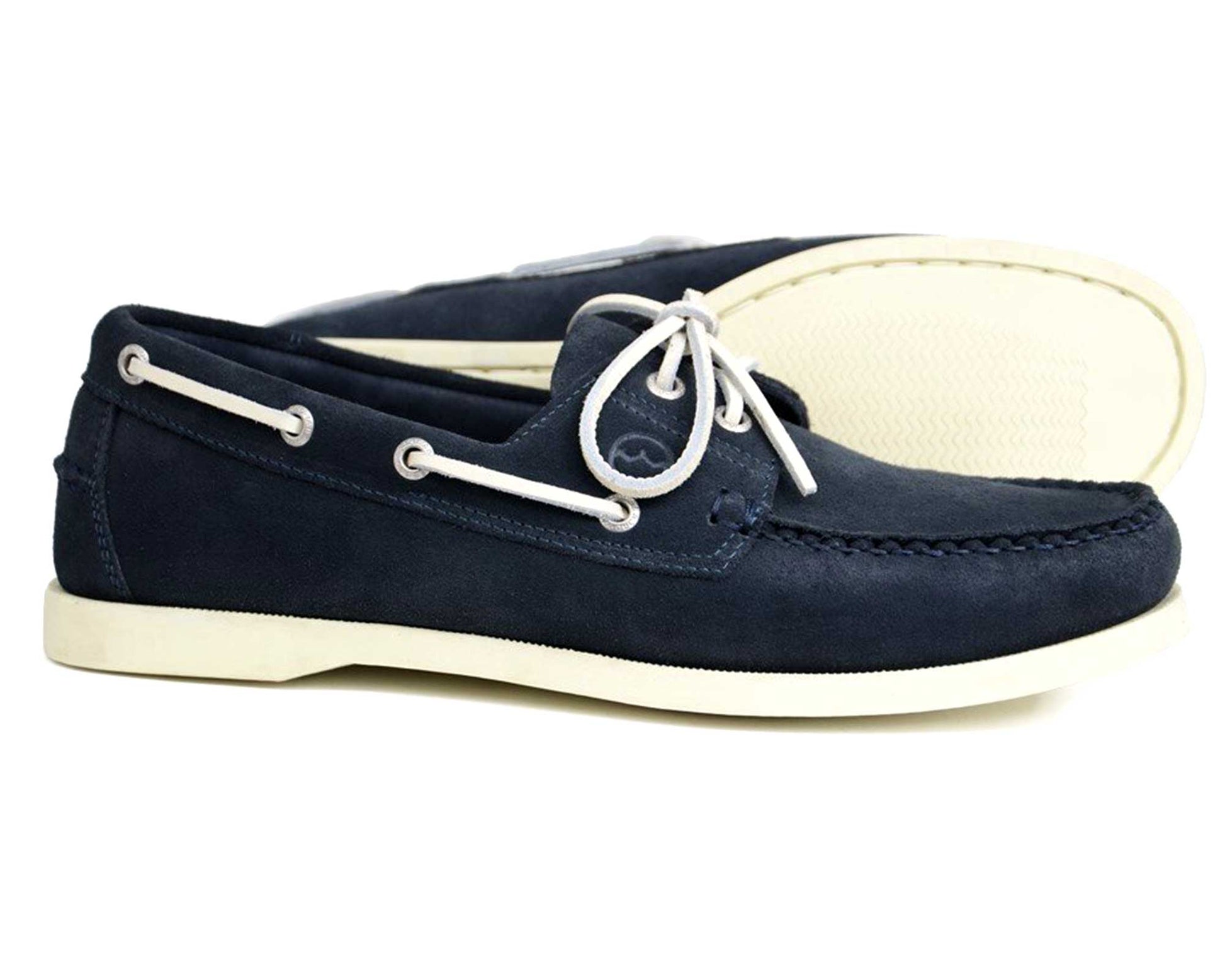 The Orca Bay MAINE Men's Navy Suede Deck Shoes feature white laces and non-slip white rubber soles, displayed with one shoe upright and the other lying on its side behind.