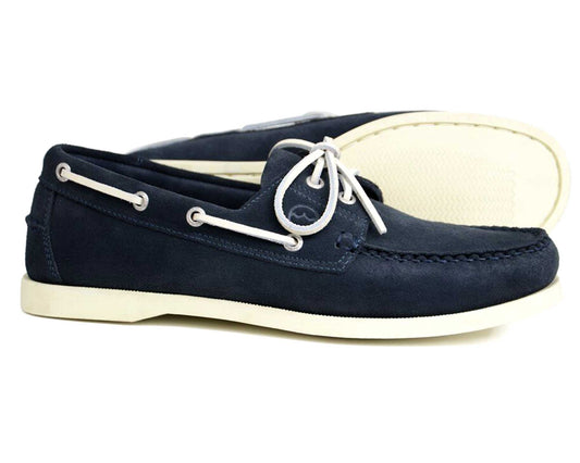 The Orca Bay MAINE Men's Navy Suede Deck Shoes feature white laces and non-slip white rubber soles, displayed with one shoe upright and the other lying on its side behind.