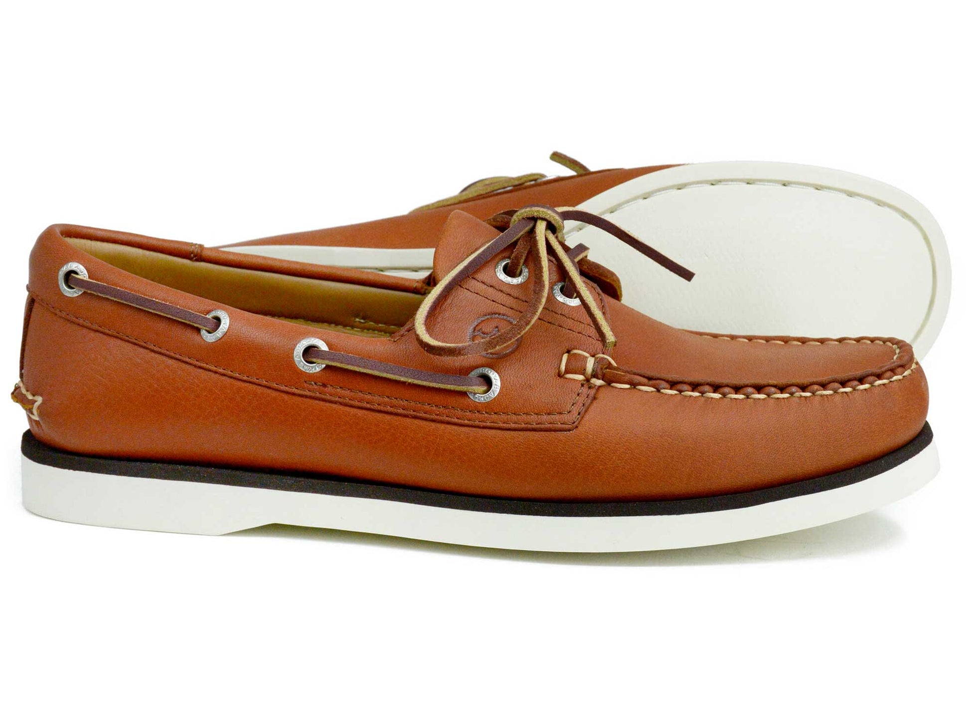 The Orca Bay Mens Portland Deck Shoe in Havana Brown Leather features white soles, laces, and stitching. Displayed on a white background, one shoe stands upright while the other lies on its side.