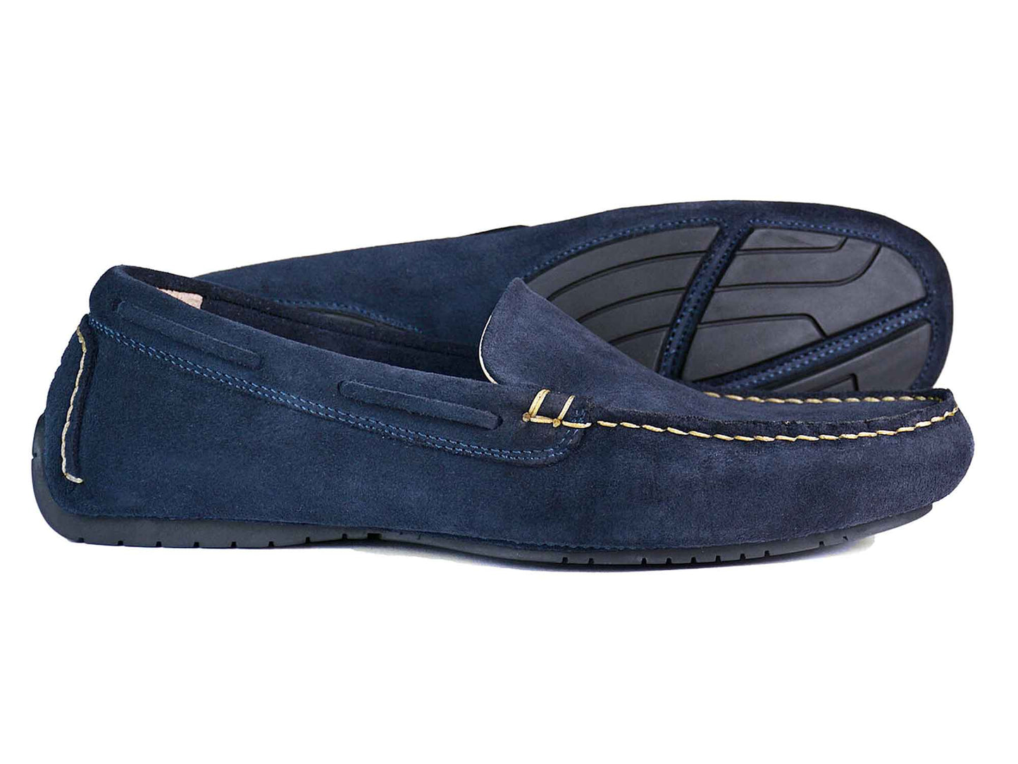 A pair of Orca Bay SILVERSTONE mens navy suede leather driving shoes with black rubber soles, visible stitching, and a moccasin-style design—one shoe stands upright while the other is on its side to show the sole.
