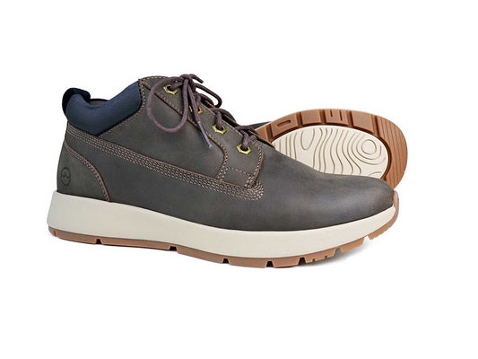 An ABERDEEN Mens Dark Brown Walking Boot by Orca Bay features oiled nubuck uppers and white rubber soles. One boot stands upright, showing the laces and stitching, while the other lays on its side, revealing the tread pattern.