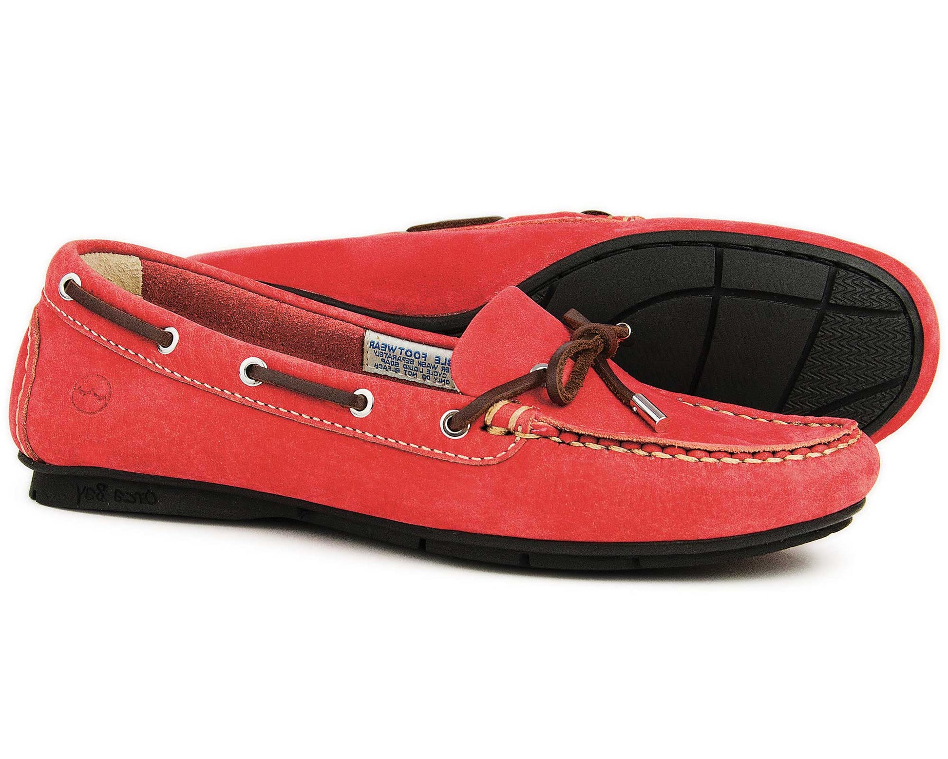 A pair of Orca Bays BALLENA Ladies Red Loafers features washable leather, brown laces, and white stitching. One shoe stands upright to highlight the sleek design while the other tilts to display the elegant black sole.