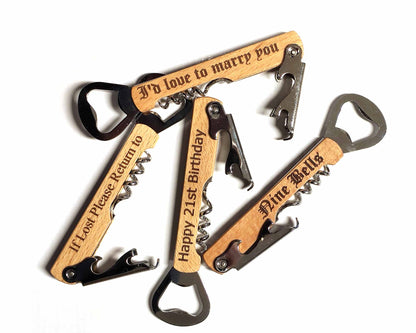 The Cathcart Elliot Personalised Wine Corkscrew and Bottle Opener with beech wood handle comes engraved with messages like "If Lost Please Return to," "I’d love to marry you," "Happy 21st Birthday," and "Nine Bells"—a perfect gift for any occasion.