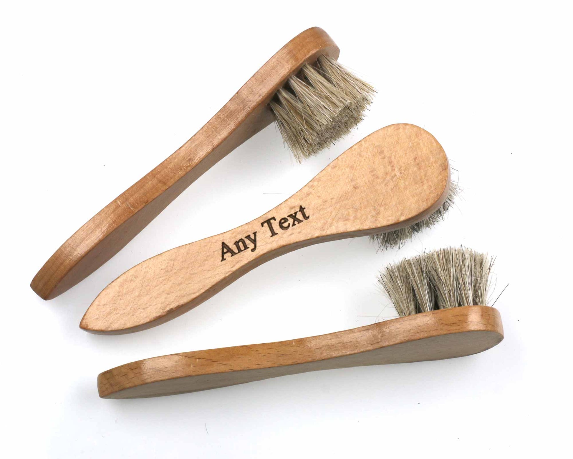 Three *second* shoe polish applicator brushes by Cathcart Elliot, featuring natural horse hair bristles and beech hardwood handles, are arranged on a white surface. One handle has "Any Text" engraved on it.