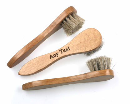 Three *second* shoe polish applicator brushes by Cathcart Elliot, featuring natural horse hair bristles and beech hardwood handles, are arranged on a white surface. One handle has "Any Text" engraved on it.
