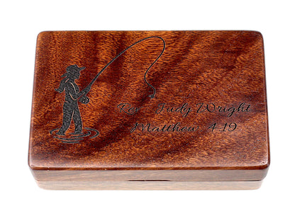 Wooden box with engraved fisherwoman design and text on a white background