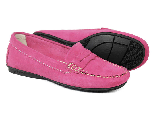 The FLORENCE Ladies Pink Suede Summer Loafers by Orca Bay feature decorative stitching and black rubber soles. Displayed side by side with one shoe angled, they highlight their elegant moccasin construction.