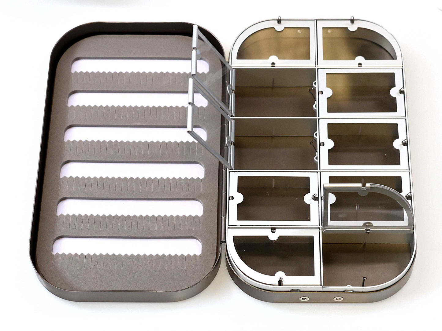 The Cathcart Elliot Personalised Grey Aluminium Fly Box for Dry & Wet Flies features foam slots on the left and nine clear, hinged compartments on the right—perfect for organizing flies. An ideal engraved fishing gift.