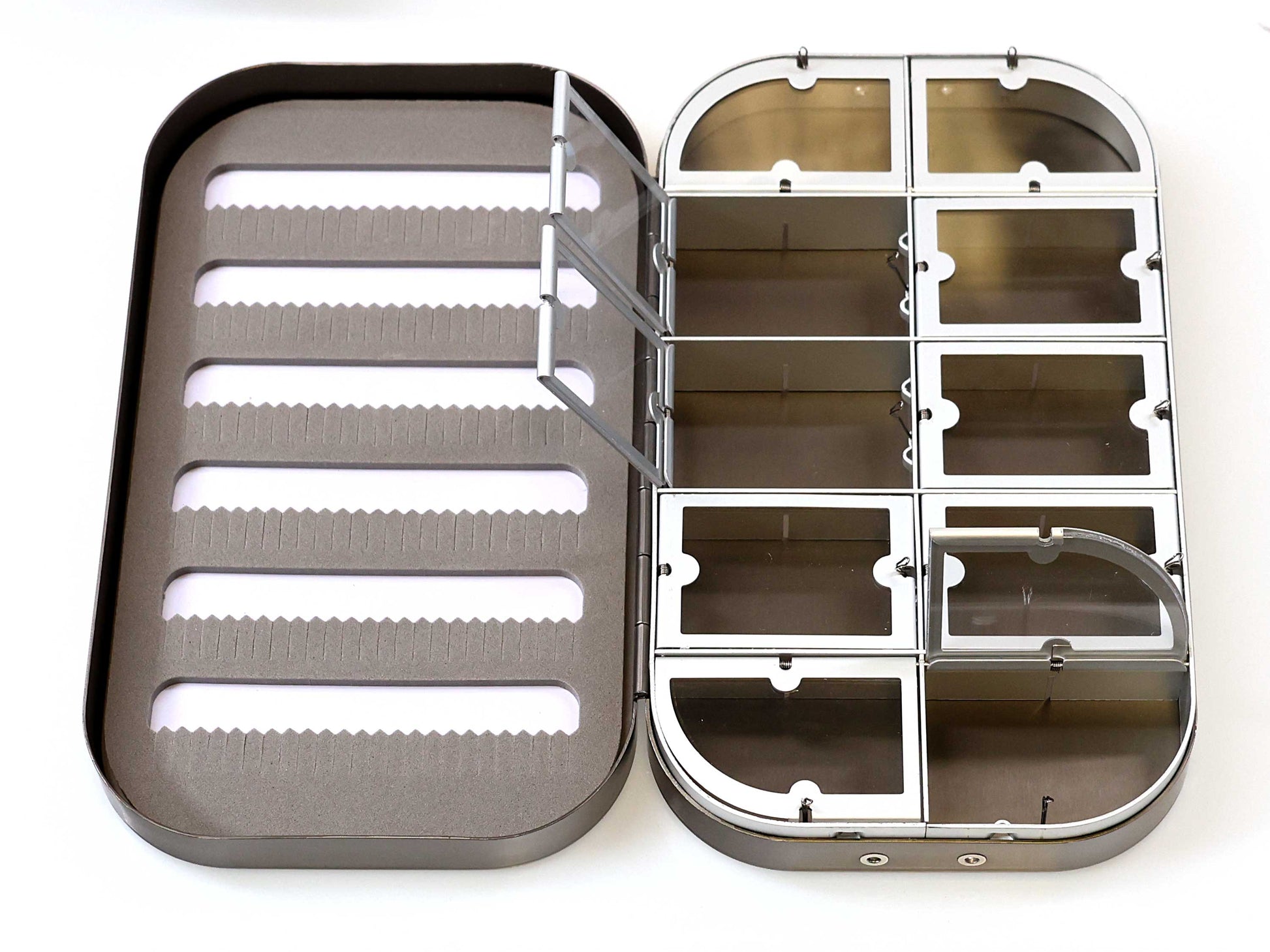 The Cathcart Elliot Personalised Grey Aluminium Fly Box for Dry & Wet Flies features foam slots on the left and nine clear, hinged compartments on the right—perfect for organizing flies. An ideal engraved fishing gift.