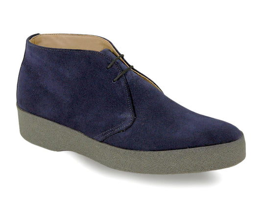 The HI TOP Mens Navy Suede Chukka Boot by Sanders features a classic design with a navy suede upper, two lace eyelets, gray crepe rubber sole, and visible edge stitching, embodying a style fit for James Bond movies.