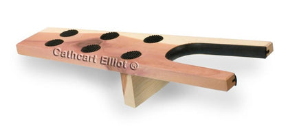 The *Seconds* Cedar Wood Boot Jack by Cathcart Elliot features a U-shaped opening and five large black rubber grips for hands-free boot removal. Made from premium aromatic cedar, Cathcart Elliot is elegantly etched on its surface.