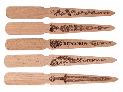 Cathcart Elliot’s Personalised beech wood letter opener features engraved ivy vines, a Celtic wolf, SCRIPTORIA with quill, or an ornate sword—an elegant stationery gift for any desk.