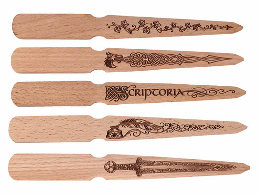 Cathcart Elliot’s Personalised beech wood letter opener features engraved ivy vines, a Celtic wolf, SCRIPTORIA with quill, or an ornate sword—an elegant stationery gift for any desk.