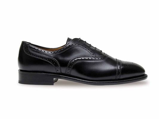 The MOORGATE Mens Black Calf Half Brogue by Sanders is shown on a white background, featuring black leather with decorative broguing, low heel, calf uppers, lace-up design, and a lightly polished finish. This expertly bench-made shoe is crafted in England by Sanders.