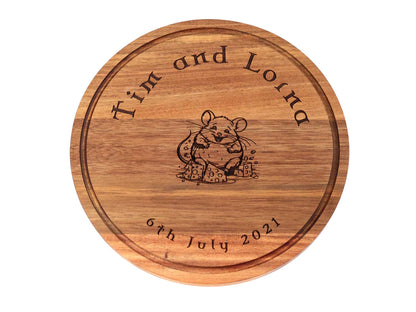Personalised Round Acacia Wood Cheese and Cutting Board 25cm x 1.5cm engraved with a mouse, Tim and Lorna, and 6th July 2021.