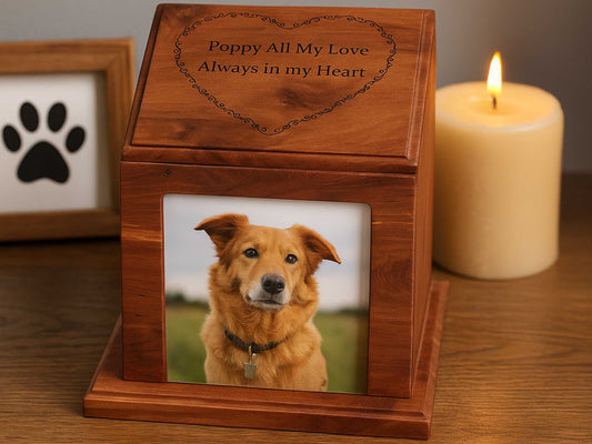 The Cathcart Elliot Engraved Cedar Wood Pet Urn features a golden dog photo, paw print frame, lit candle, and the engraving Poppy All My Love Always in my Heart—a graceful ashes box to preserve pet memories.