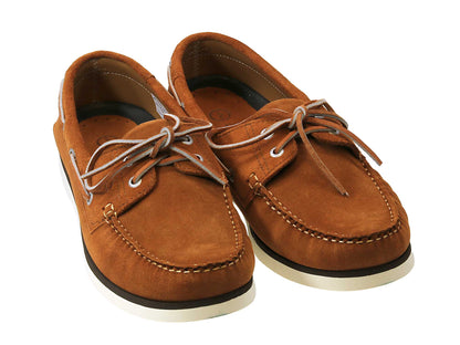 These PORTLAND Cinnamon Brown Suede Boat Shoes by Orca Bay, from Cathcart Elliot, feature premium suede uppers in brown with white non-slip rubber soles and beige laces. The classic design includes stitching details along the edges and around the laces, ideal for everyday wear.