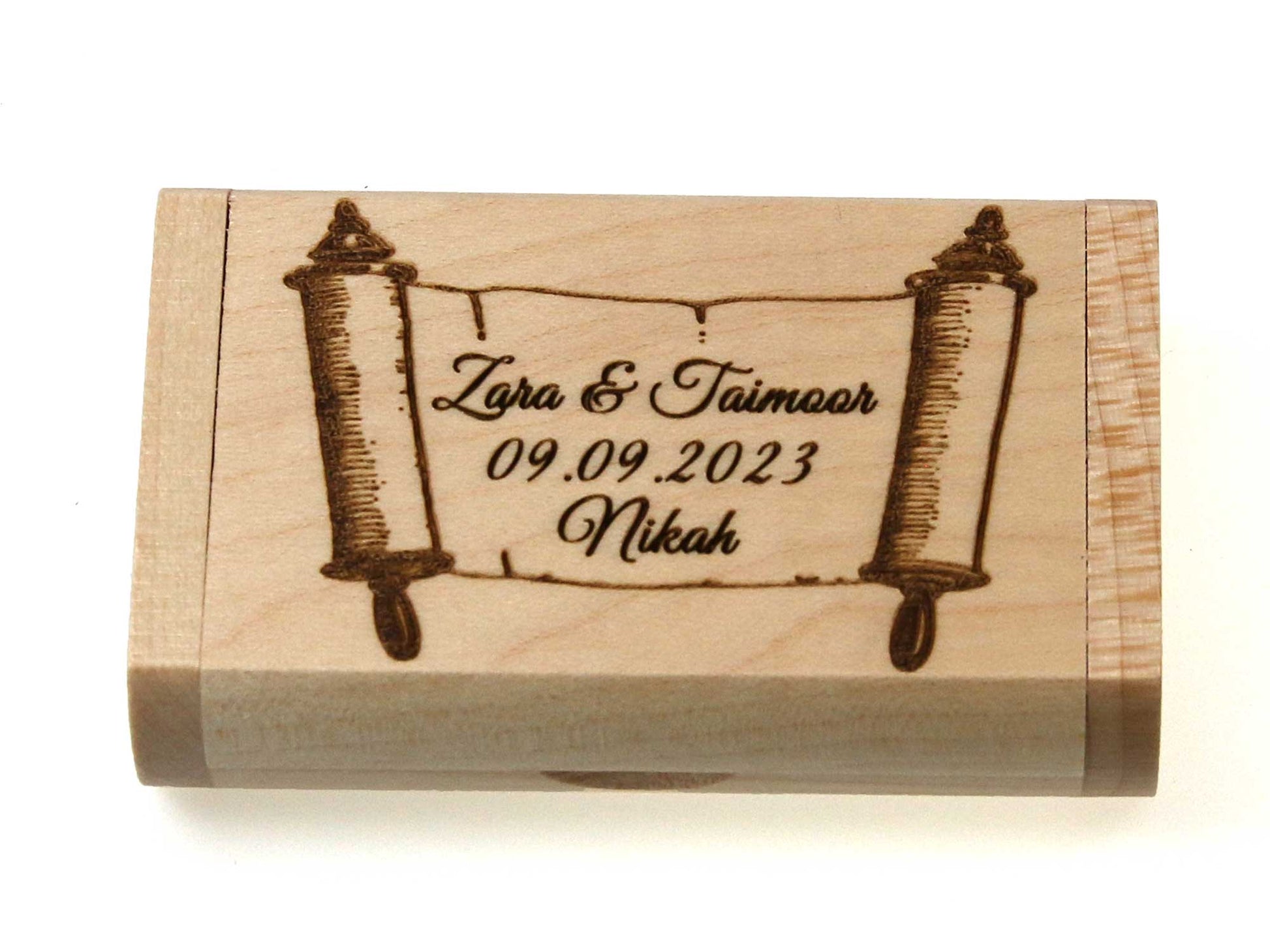 The Cathcart Elliot Personalised Maple wood USB 3.0 32GB flash drive, engraved with text and scroll motifs, comes in a stunning presentation box to preserve treasured memories.