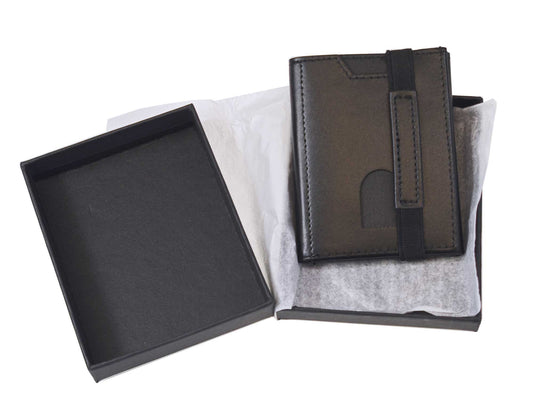 The Cathcart Elliot Compact Mini Black Leather Pocket Wallet Minimalist Slim RFID Personalised rests on white tissue inside an open black gift box, with the lid nearby.