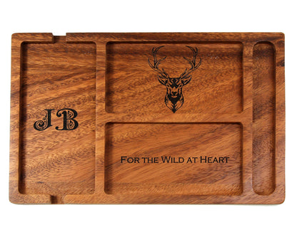 The Cathcart Elliot Personalised Walnut Wood Valet Tray for Men is a stylish organiser with multiple compartments for phone, wallet, keys, and watch. Custom engraved with initials, a stag head, and "FOR THE WILD AT HEART.