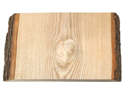 The Cathcart Elliot Engraved Wood Door Sign is a rectangular light wood slab with rustic live edge bark on two sides and a central knot, ideal for creating personalized wall signs or large door signs.