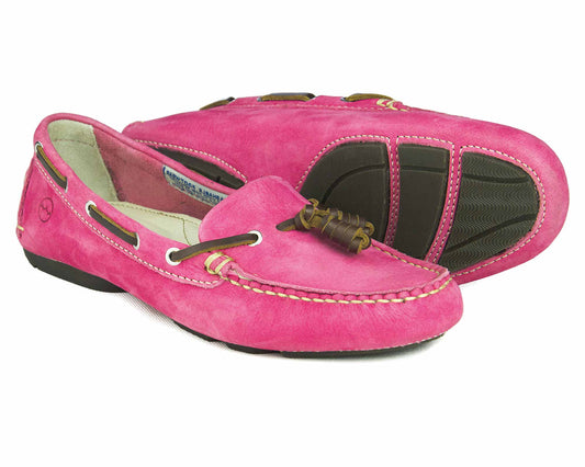 The SALE YARRAWONGA Womens Magenta Pink washable deck shoes by Orca Bay feature pink suede with brown leather lace and tan stitching, textured black rubber soles for grip, blending style with practicality.
